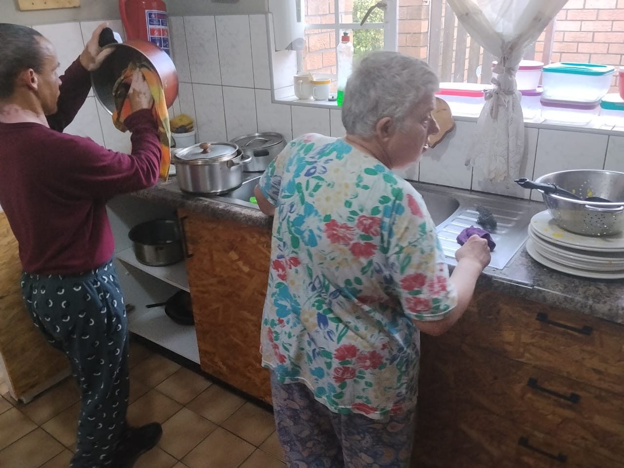 Washing dishes in the kitchen